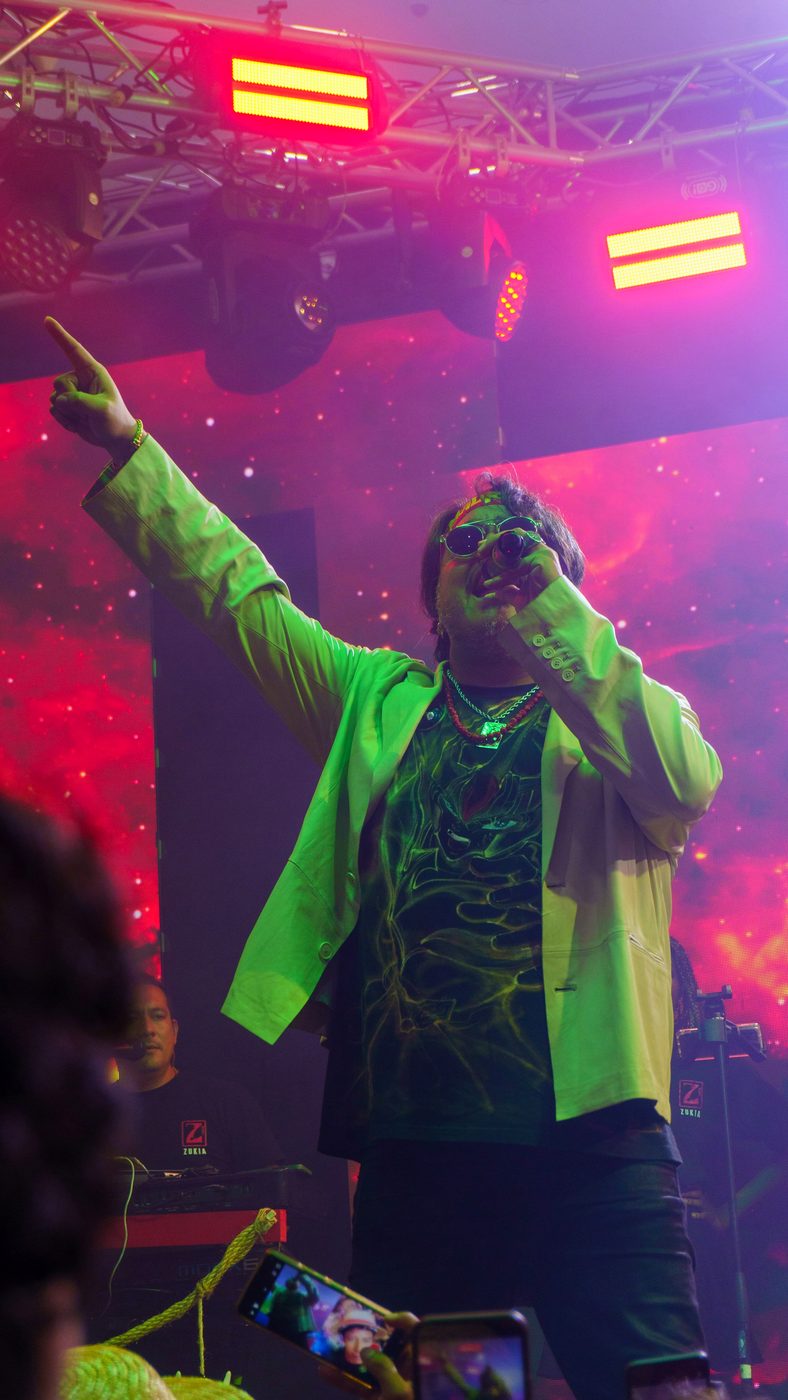 A singer on a colourful stage
