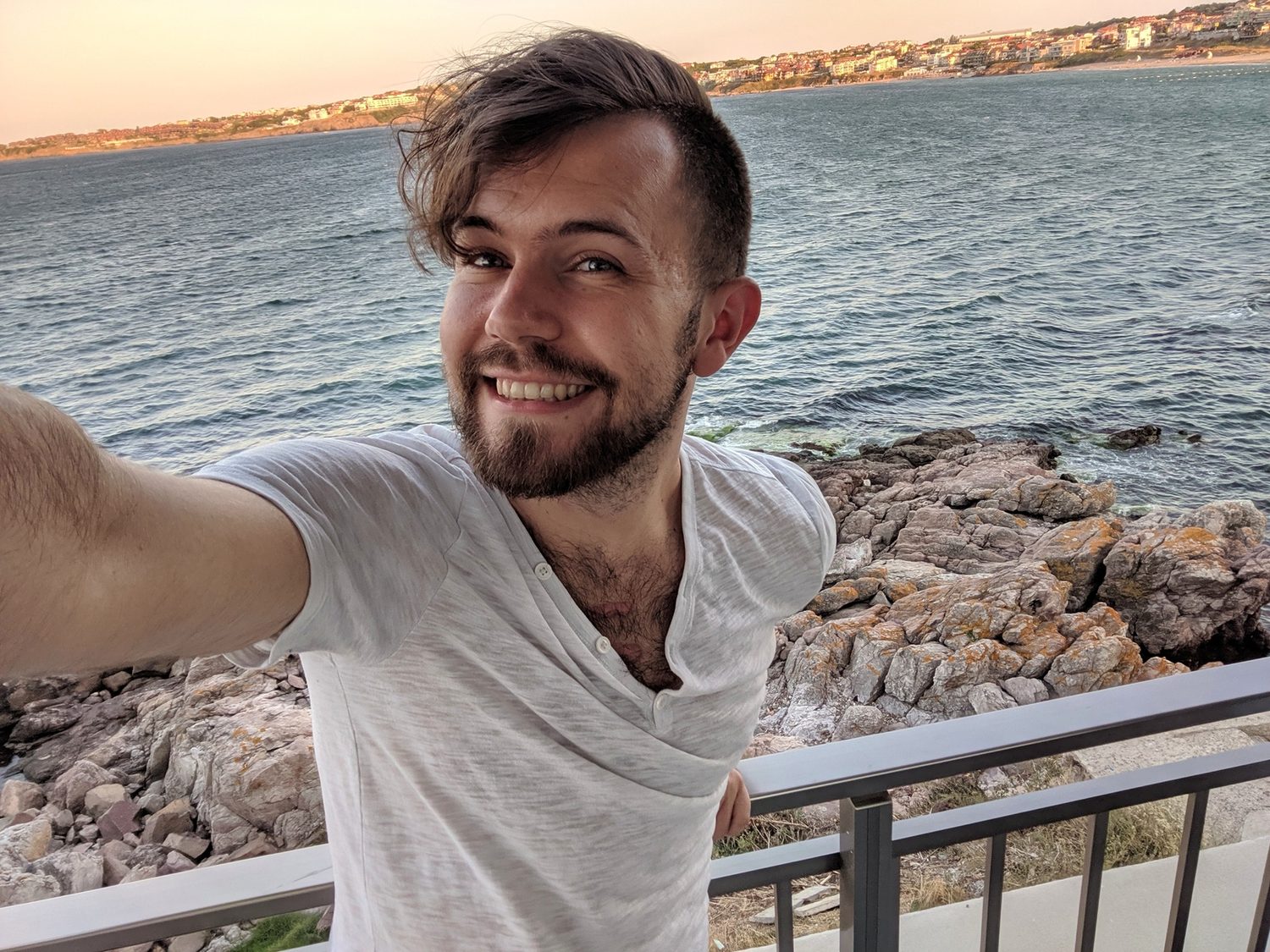 Zack smiling by the sea